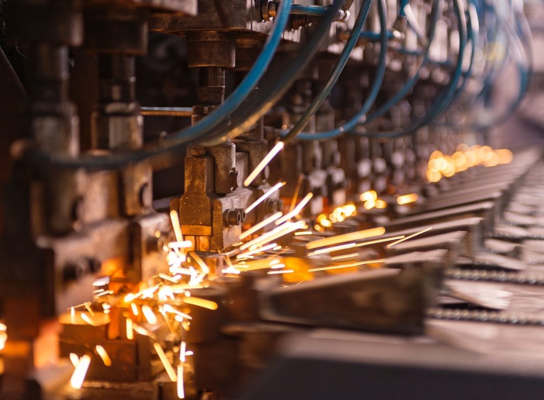 Wire drawing machine in operation with sparks