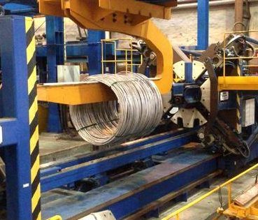 Wire coiling machine in operation